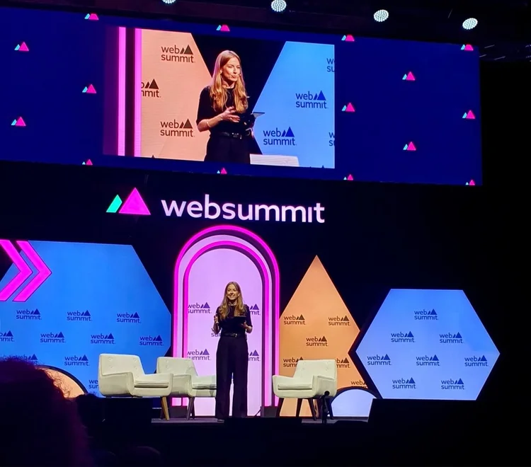 Alicia speaking on stage at Web Summit